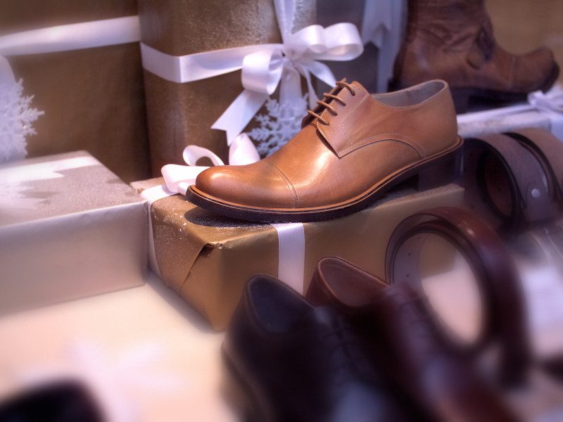 leather shoe on display on top of Christmas gifts